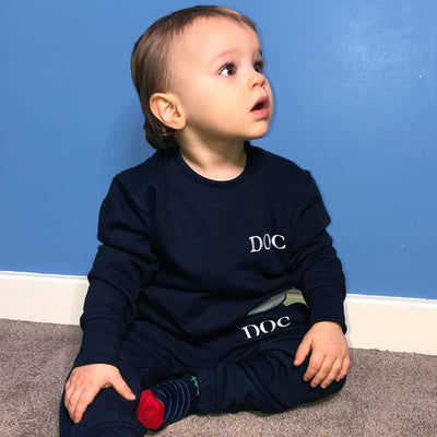 Personalised Baby Navy Tracksuit, being modelled