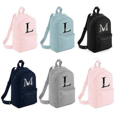 6 Different Personalised Mini Backpacks, with colours including Pink, Blue, Navy, Black and Grey